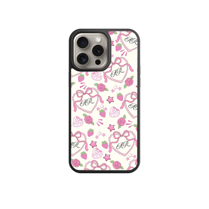 a phone case with a pink and white pattern, including hearts, stars, and other decorative elements.